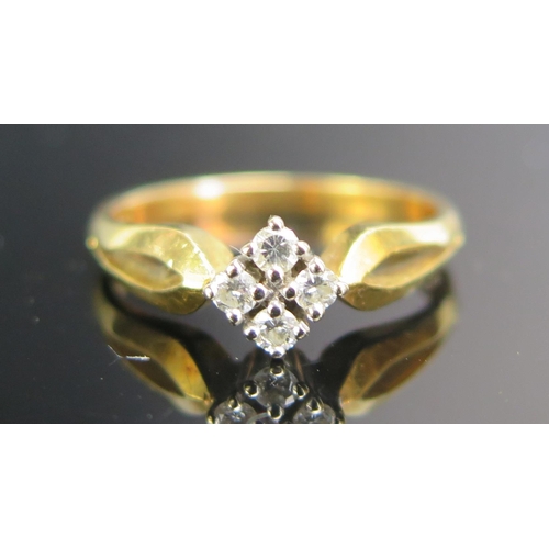 216 - An 18ct Gold and Diamond Four Stone Ring, stamped 750, sizeO.75, 3.87g