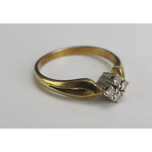 216 - An 18ct Gold and Diamond Four Stone Ring, stamped 750, sizeO.75, 3.87g