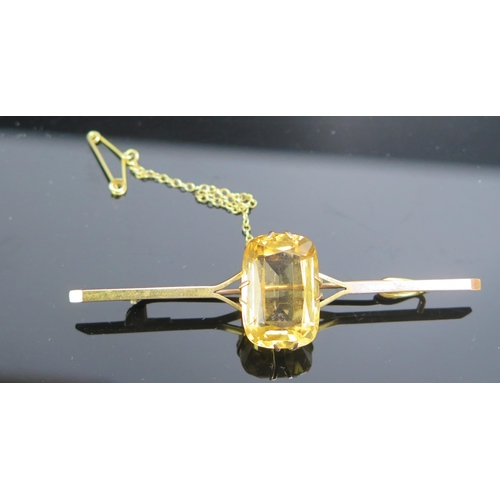 224 - A 9ct Gold and Citrine Bar Brooch, 19x13mm stone, stamped 9CT, 70mm, 7.56g