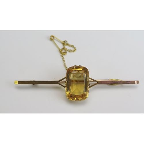 224 - A 9ct Gold and Citrine Bar Brooch, 19x13mm stone, stamped 9CT, 70mm, 7.56g