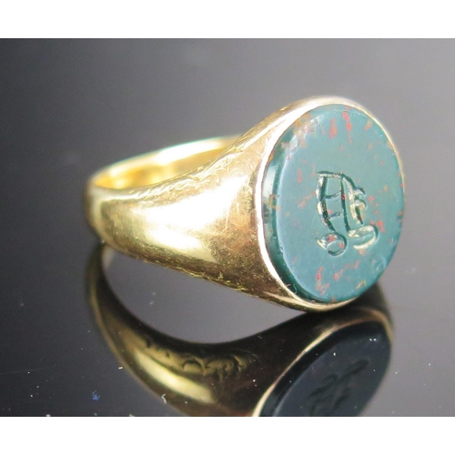 225 - A Precious Yellow Metal and Bloodstone Signet Ring, KEE tested as 14ct, size P.25, 8.13g