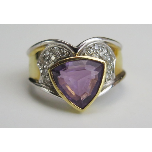 227 - A Modern 18ct Gold, Diamond and Amethyst? Ring, stamped 750, size M, 7.74g