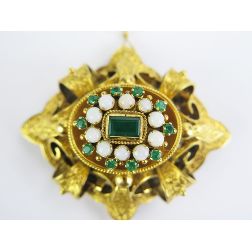 23 - An 18ct Gold, Emerald and Opal Brooch with detachable pendant which can be worn as a necklace with f... 