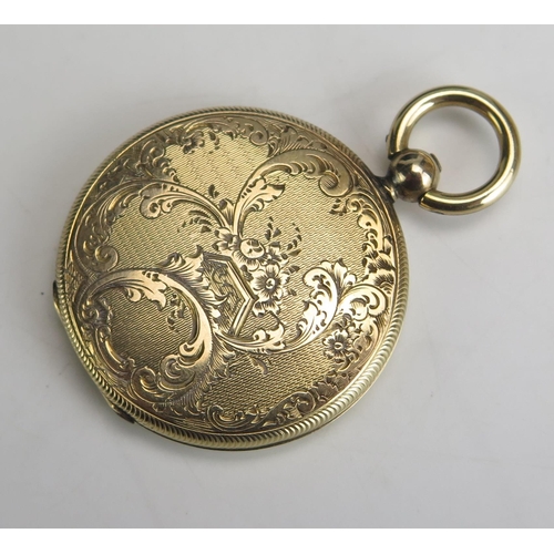 239 - An Antique Yellow Metal Locket Fob with engine turned and chased foliate scroll decoration, 28.5mm d... 