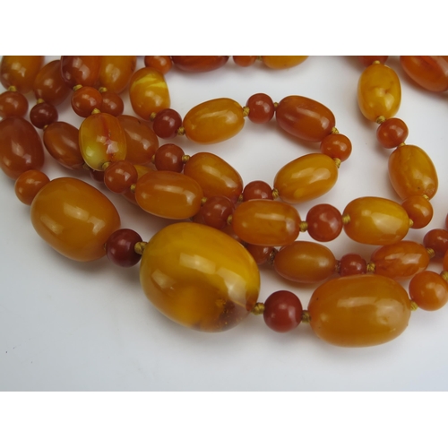 248 - A Large Baltic Amber Bead Necklace, largest bead c. 31.6x25.9mm, 62