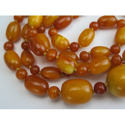 248 - A Large Baltic Amber Bead Necklace, largest bead c. 31.6x25.9mm, 62