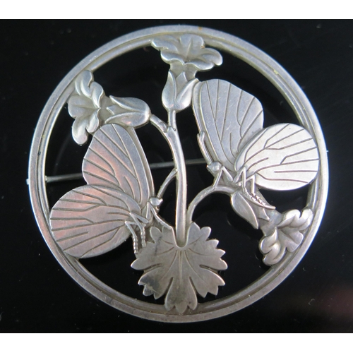 250 - A Georg Jensen Silver Brooch decorated with butterflies and flowers, model 283, 54mm diam., import m... 