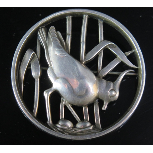 252 - A Georg Jensen Silver Brooch decorated with a lapwing or pewit, model 297, London 1962 import marks,... 