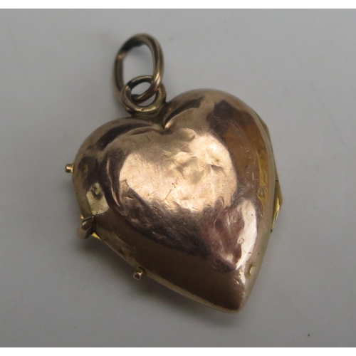 255 - A 19th Century Precious Yellow Metal and Enamel Heart Shaped Locket decorated with Cupid, 27.5mm dro... 