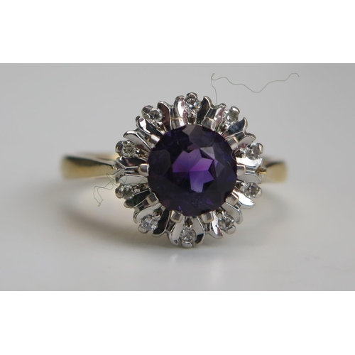 256 - A Modern 18ct Gold, Amethyst and Diamond Cluster Ring, c. 6.8mm principal stone, 11.8mm head, hallma... 