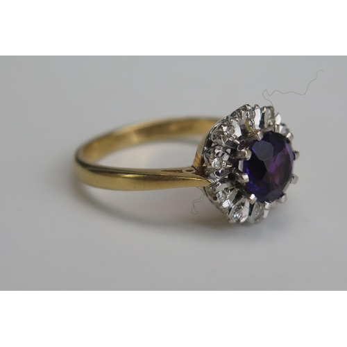 256 - A Modern 18ct Gold, Amethyst and Diamond Cluster Ring, c. 6.8mm principal stone, 11.8mm head, hallma... 