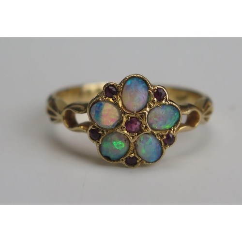 258 - An Antique 18ct Gold, Opal and Ruby Cluster Ring, 10mm head, Chester 1909, size M.25, 3g. Two stones... 