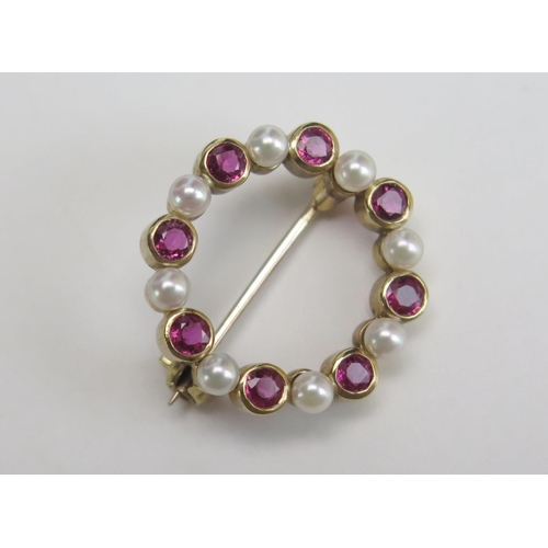 262 - A 9ct Gold, Ruby and untested Pearl Brooch, 21mm diam., hallmarked, 3.42g