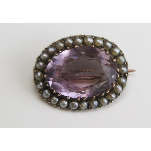 263 - An Amethyst and untested Pearl Brooch in a precious yellow metal setting, 21.5x17mm, KEE tested as 9... 