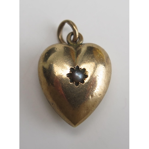 265 - A 9ct Gold and untested Pearl Heart Shaped Pendant, stamped 9CT, 25mm drop, 2.24g