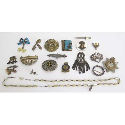 295 - A Silver Necklace with a 'bunch of keys' pendant and other costume jewellery, Military cap badge, et... 