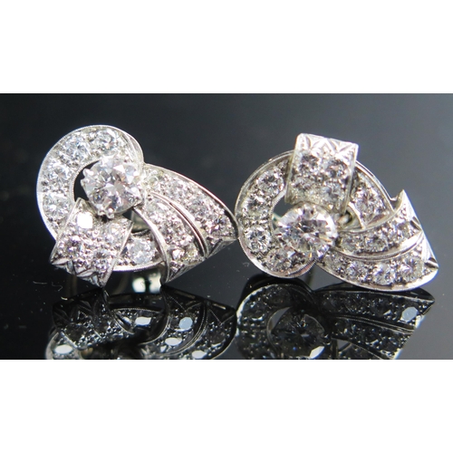 311 - A Pair of Deco Earrings in a precious white metal setting, c. 5.9mm principal stones, 22mm overall, ... 