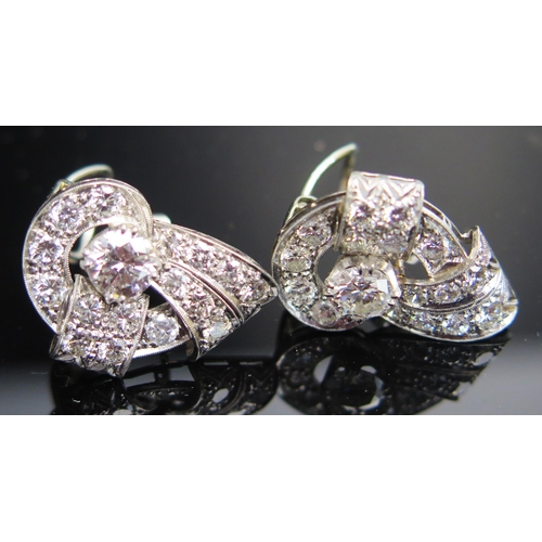 311 - A Pair of Deco Earrings in a precious white metal setting, c. 5.9mm principal stones, 22mm overall, ... 