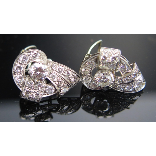 311 - A Pair of Deco Earrings in a precious white metal setting, c. 5.9mm principal stones, 22mm overall, ... 