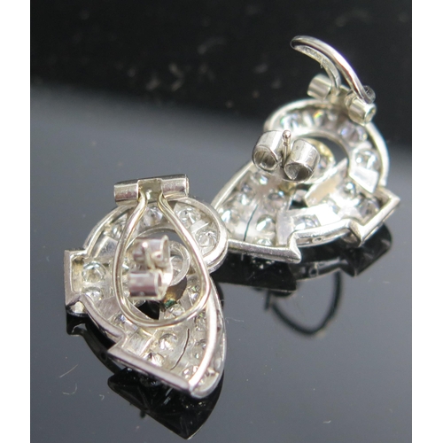 311 - A Pair of Deco Earrings in a precious white metal setting, c. 5.9mm principal stones, 22mm overall, ... 