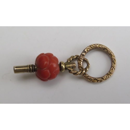 312 - A 19th Century Carved Coral and Precious Yellow Metal Watch Key with jump ring, 33mm overall, KEE te... 