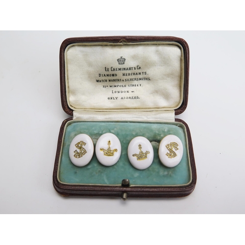 313 - A Pair of Diamond and Enamel Cufflinks in a precious yellow metal setting, decorated with a crown an... 