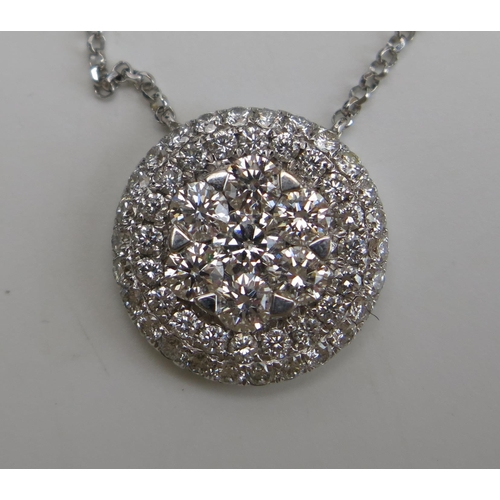 320 - An 18ct White Gold and Diamond Pendant on an integral chain, stamped 750, 1.27ct, 13mm diam., 17.5