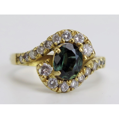 331 - An 18ct Gold, Green Sapphire and Diamond Cross Over Ring, stamped 750, c. 7.2x5.9mm principal stone,... 