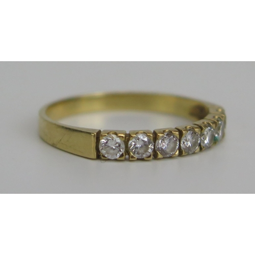 332 - An 18ct Gold and Diamond Seven Stone Ring, hallmarked, c. 2.2mm brilliant round cuts, size O.5, 2.08... 