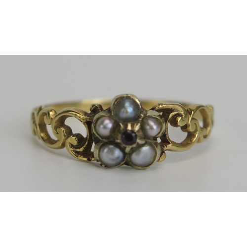 342 - A Victorian Seed Pearl and Garnet Ring in a precious yellow metal setting, size P.5, KEE tested as 1... 