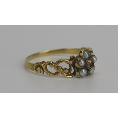 342 - A Victorian Seed Pearl and Garnet Ring in a precious yellow metal setting, size P.5, KEE tested as 1... 