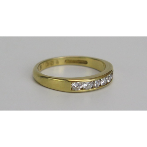 343 - An 18ct Gold and Diamond Seven Stone Ring, hallmarked, .5ct channel set diamonds, size M.5, 3.28g