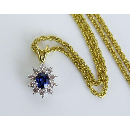 348 - An 18ct Gold, Sapphire and Diamond Pendant (16mm drop, 1.29g) and on a 9ct gold chain (17.5