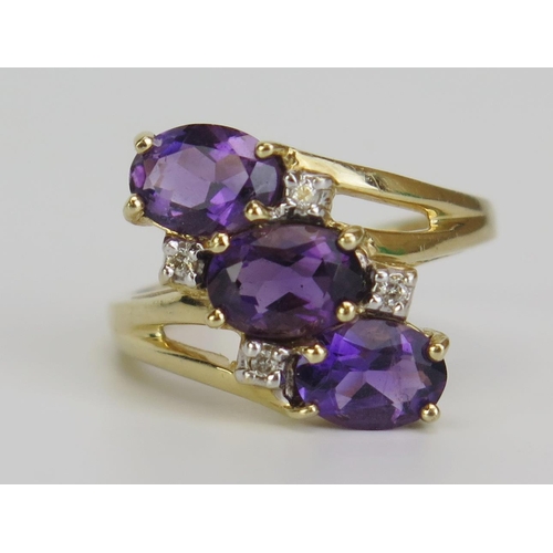 353 - A 14K Gold, Amethyst and Diamond Crossover Ring, size L.25, 3.6g