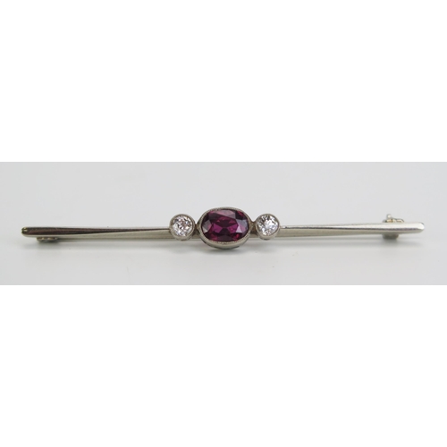 357 - A Ruby and Diamond Bar Brooch in a precious white metal setting, the millegrain set pigeon blood rub... 