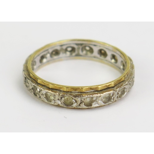 50 - An 18ct Gold and White Stone Eternity Ring, 4.5mm wide, size O.75, 4.3g