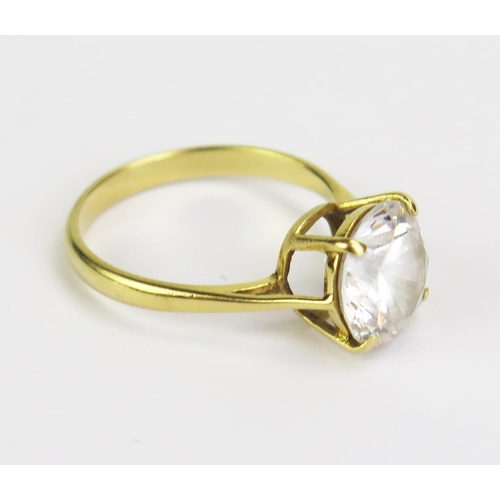 51 - An 18ct Gold and CZ Solitaire Ring, hallmarked, 10mm stone, size O.5, 3.91g