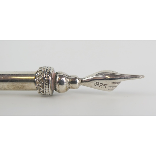 557 - A continental silver Torah yad or pointer, stamped 925, with knopped and tapering stem 20cm long.