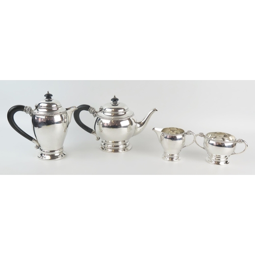 567 - A George V silver four-piece tea service, maker William Neale, Birmingham, 1926, of ovoid form with ... 