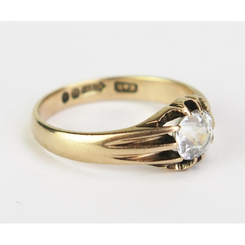 57 - An Antique 9ct Gold and White Topaz? Solitaire Ring, the c. 6.3x5.9x4.3mm old cushion cut stone in a... 