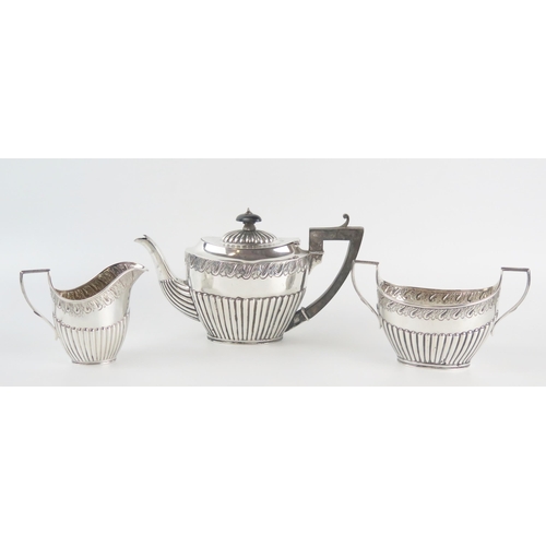 596 - A Victorian silver bachelors three-piece tea service, maker Martin, Hal, & Co, London, 1889/90, of o... 