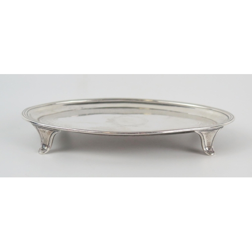 603 - A George III silver teapot stand, maker John Emes , London, 1800, of oval outline with chased banded... 