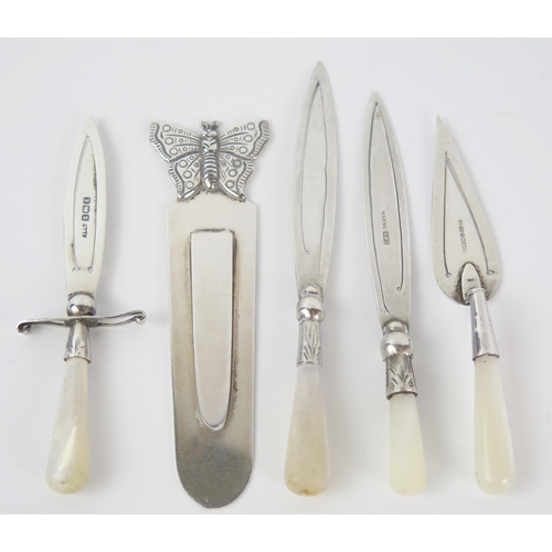 626 - A collection of five silver book marks, one with butterfly terminal, one in the form of a dagger and... 