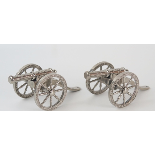 628 - A pair of silver plated models of Napoleonic style cannons, with removable barrels, 15cm long.