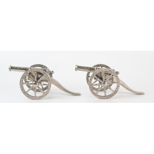 628 - A pair of silver plated models of Napoleonic style cannons, with removable barrels, 15cm long.