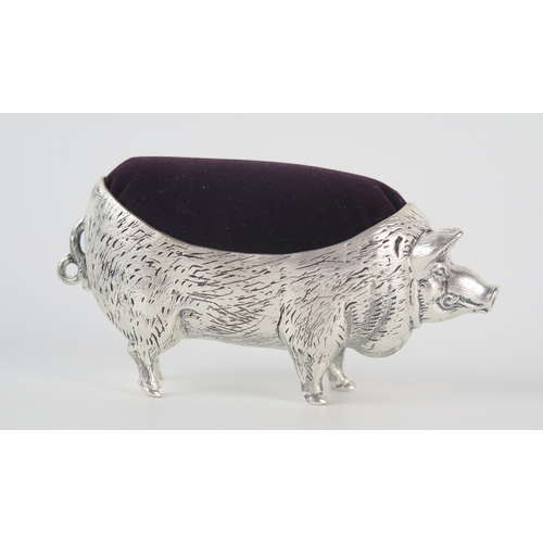 651 - A continental silver novelty pin cushion, stamped 800, in the form of a pig, 11cm long.