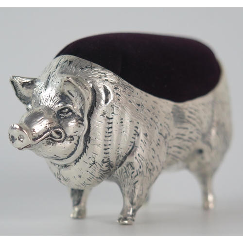 651 - A continental silver novelty pin cushion, stamped 800, in the form of a pig, 11cm long.