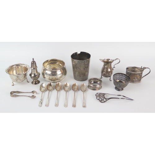 653 - A mixed collection of silverwares, various makers and dates, includes mustard pot, napkin ring, suga... 