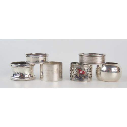 659 - Six assorted silver and plated napkin rings, including SS Highlander Rover napkin ring, total weight... 