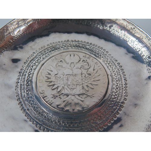 679 - A pair of Persian silver circular dishes inset with thalers, 10cm diameter, 153gms, 4.93ozs